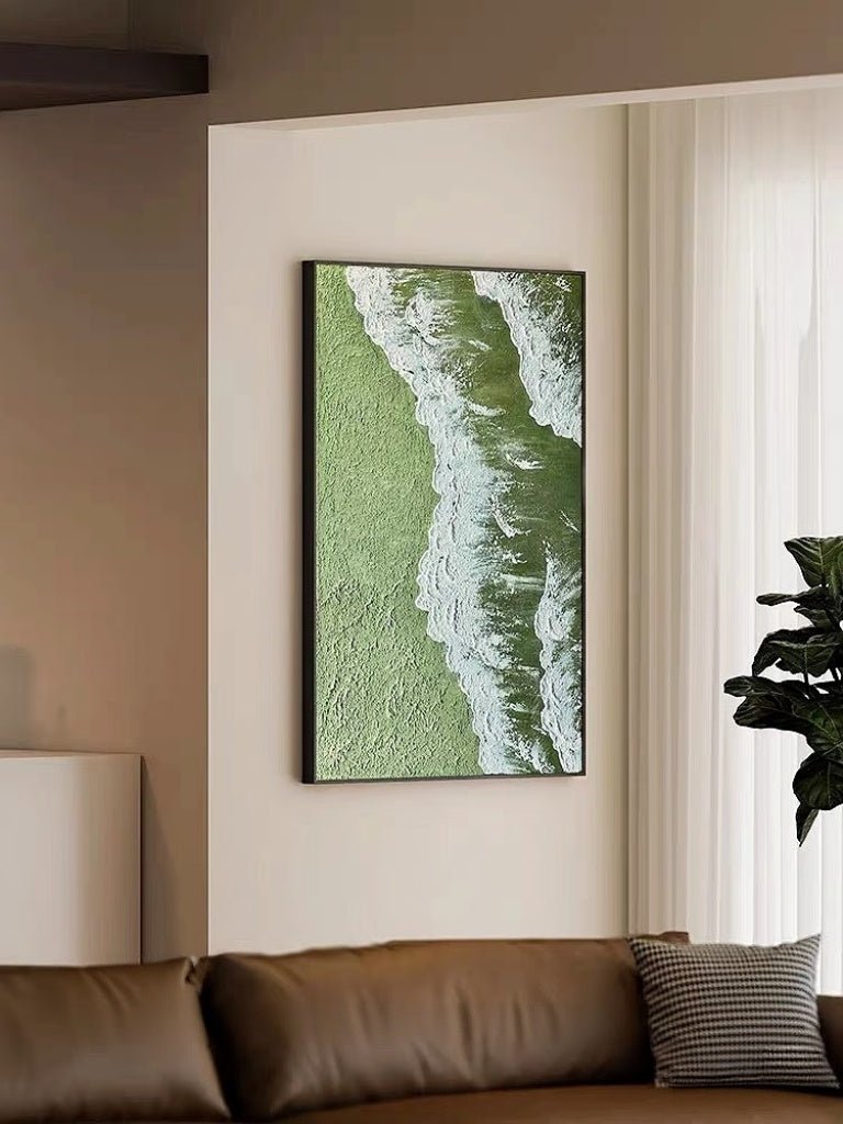 High-relief 3D textured painting showing white sculpted seafoam splashing over a deep forest green background in a gold frame.