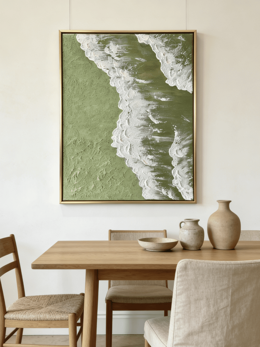 High-relief 3D textured painting showing white sculpted seafoam splashing over a deep forest green background in a gold frame.