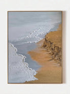 Large vertical hand-painted ocean seascape painting with heavy impasto white foam waves and golden cliffs by Leo Liang in a modern living room.