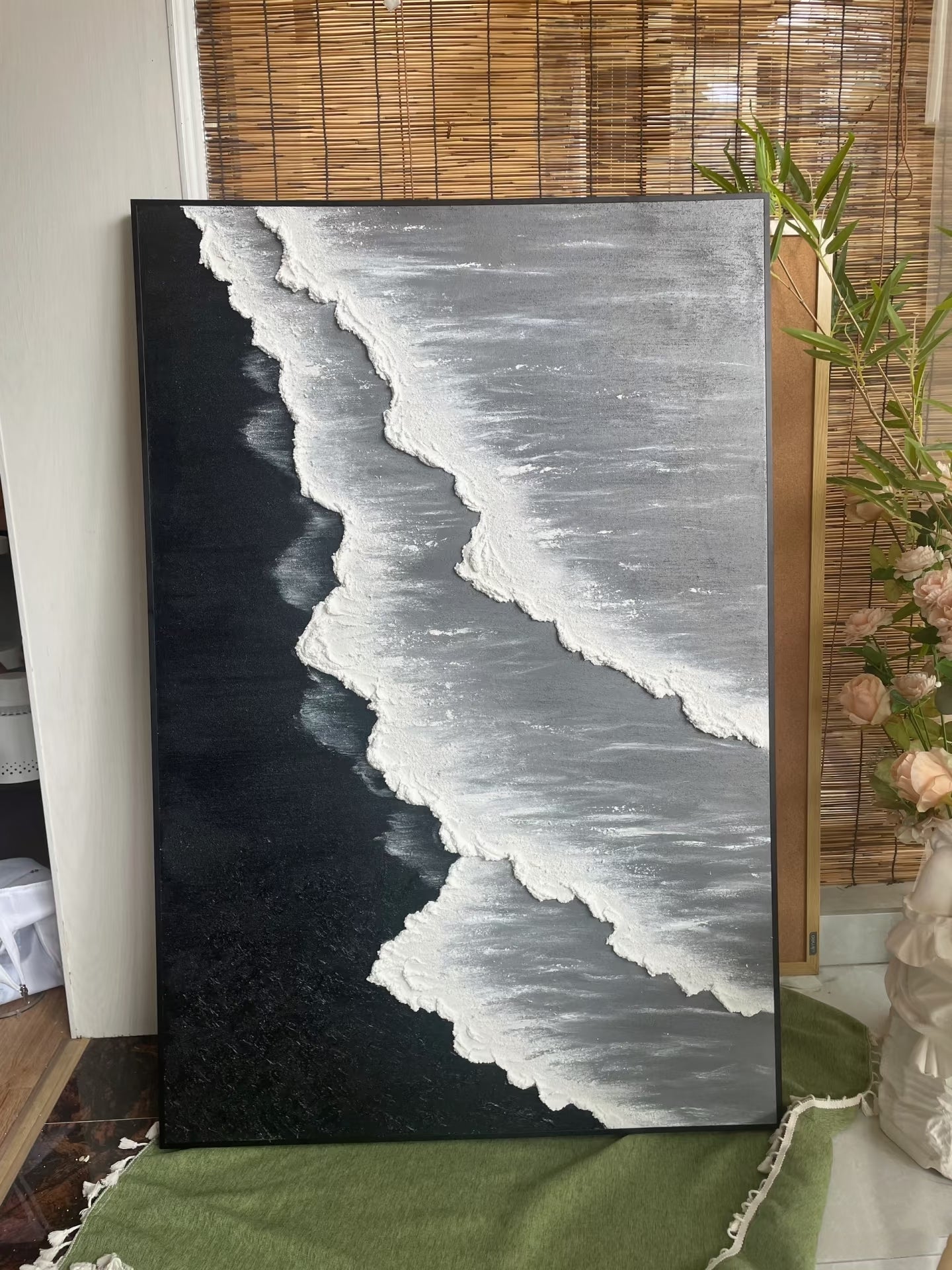 Large vertical hand-painted black sand beach seascape with heavy 3D textured white waves and grey ocean by Leo Liang in a modern living room.