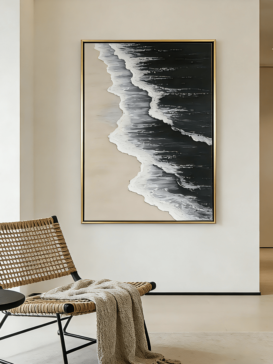 Large vertical hand-painted black ocean painting with heavy 3D white foam texture and beige sand by Leo Liang in a modern minimalist interior.