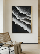 Large vertical hand-painted black and white abstract seascape with extra heavy 3D textured waves by Leo Liang in a modern minimalist room.