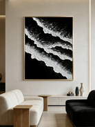 Large vertical hand-painted black and white abstract seascape with extra heavy 3D textured waves by Leo Liang in a modern minimalist room.