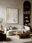 Hand-painted minimalist abstract art; white flowing lines on black canvas and black lines on cream canvas.