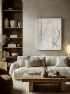 Hand-painted minimalist abstract art; white flowing lines on black canvas and black lines on cream canvas.
