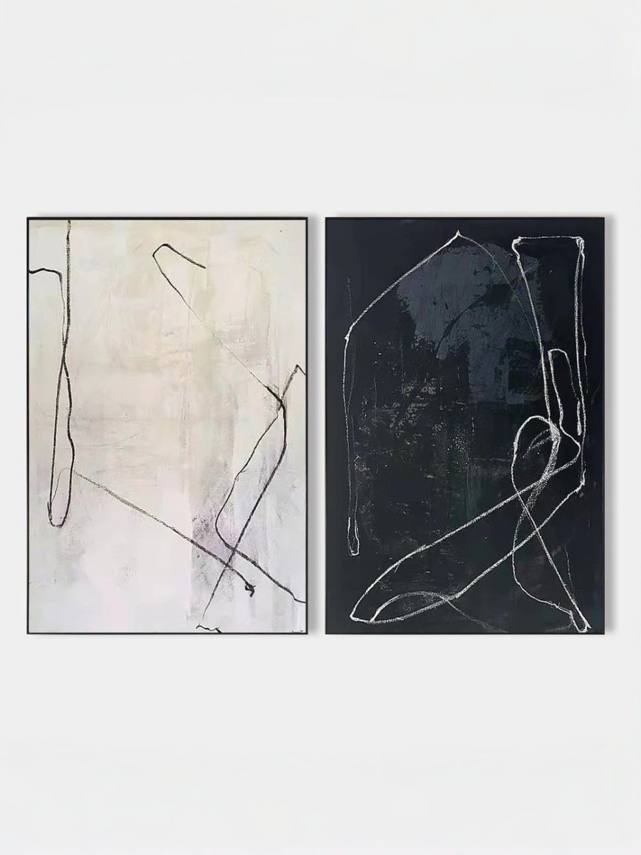 Pair of large hand-painted abstract paintings with white lines on black and black lines on white background, modern gallery-style diptych