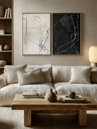 Pair of large hand-painted abstract paintings with white lines on black and black lines on white background, modern gallery-style diptych