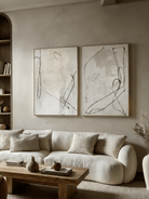Large hand-painted abstract line art diptych in black and white, modern wall decor set for luxury living room.