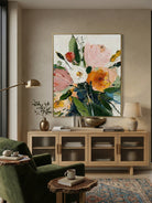 Close-up of 3D heavy textured orange, pink, and white flowers with thick palette knife strokes on a canvas