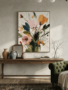 Vertical 3D textured floral painting showing heavy impasto orange and pink flowers on a white background in a modern bedroom.