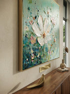 Close-up of 3D heavy textured white flowers with palette knife strokes on a sage green background, hand-painted by Luna Xiao.