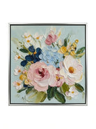 Large square 3D textured floral painting showing heavy impasto pink and white flowers on a light blue background in a modern living room.