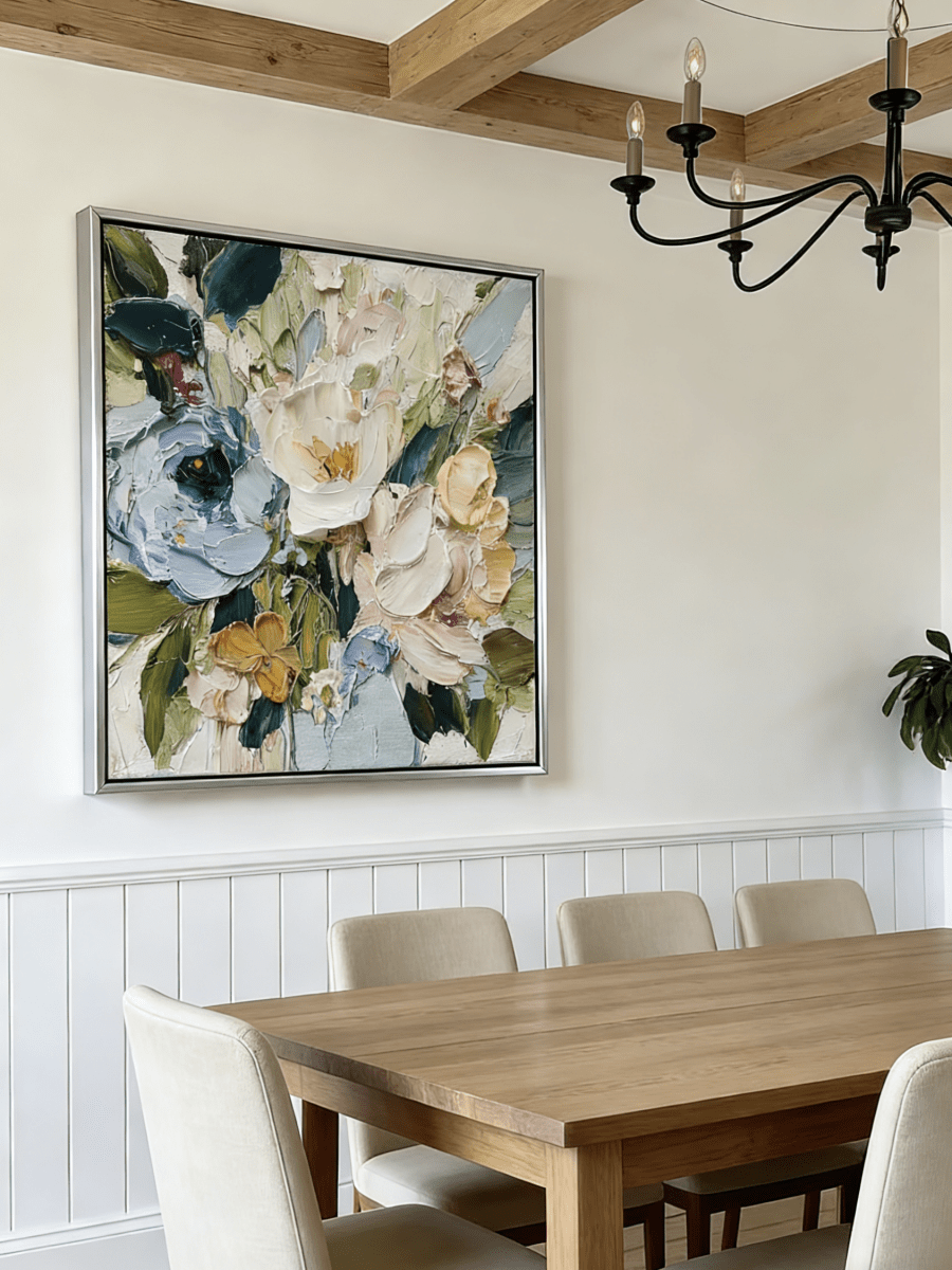 Large square 3D textured floral painting showing heavy impasto green and white flowers in a modern bright living room.