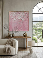 Close-up of large 3D textured abstract painting showing heavy white and taupe impasto ridges on canvas in a luxury living room.