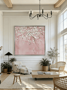 Close-up of large 3D textured abstract painting showing heavy white and taupe impasto ridges on canvas in a luxury living room.