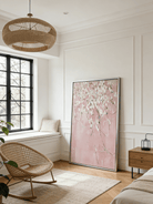 Close-up of large 3D textured abstract painting showing heavy white and taupe impasto ridges on canvas in a luxury living room.