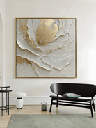 Macro shot of heavy 3D impasto texture on a white and gold abstract painting by Luna Xiao, showing deep sculptural ridges and gold leaf reflections.