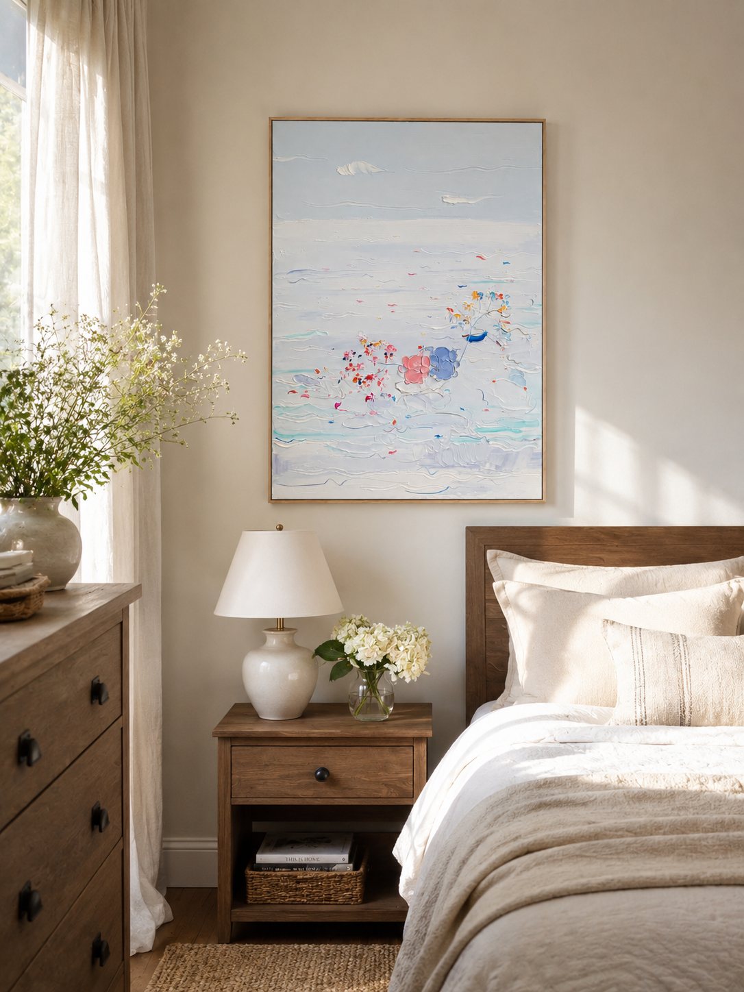 Pale blue textured ocean wall art styled in a serene neutral bedroom