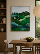 Hand-painted Tuscan countryside landscape displayed in a dining room with natural wood furniture