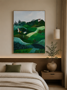 Italian countryside wall art with rolling green hills displayed above the bed in a calm bedroom