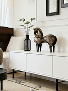 abstract horse sculpture with antique gold leaf finish on black resin, modern equestrian art for luxury home decor.