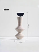 abstract geometric resin sculpture with sandstone texture, minimalist cream and black totem for modern home office shelf decor.