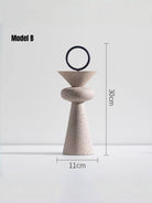 abstract geometric resin sculpture with sandstone texture, minimalist cream and black totem for modern home office shelf decor.