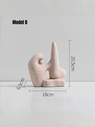 abstract biomorphic resin sculptures, sandstone texture stone art and wood finish running bird figurine on a bookshelf.