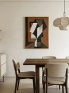A hand-painted mid-century modern geometric portrait on canvas, featuring orange, green, and blue color blocks in a gold frame.