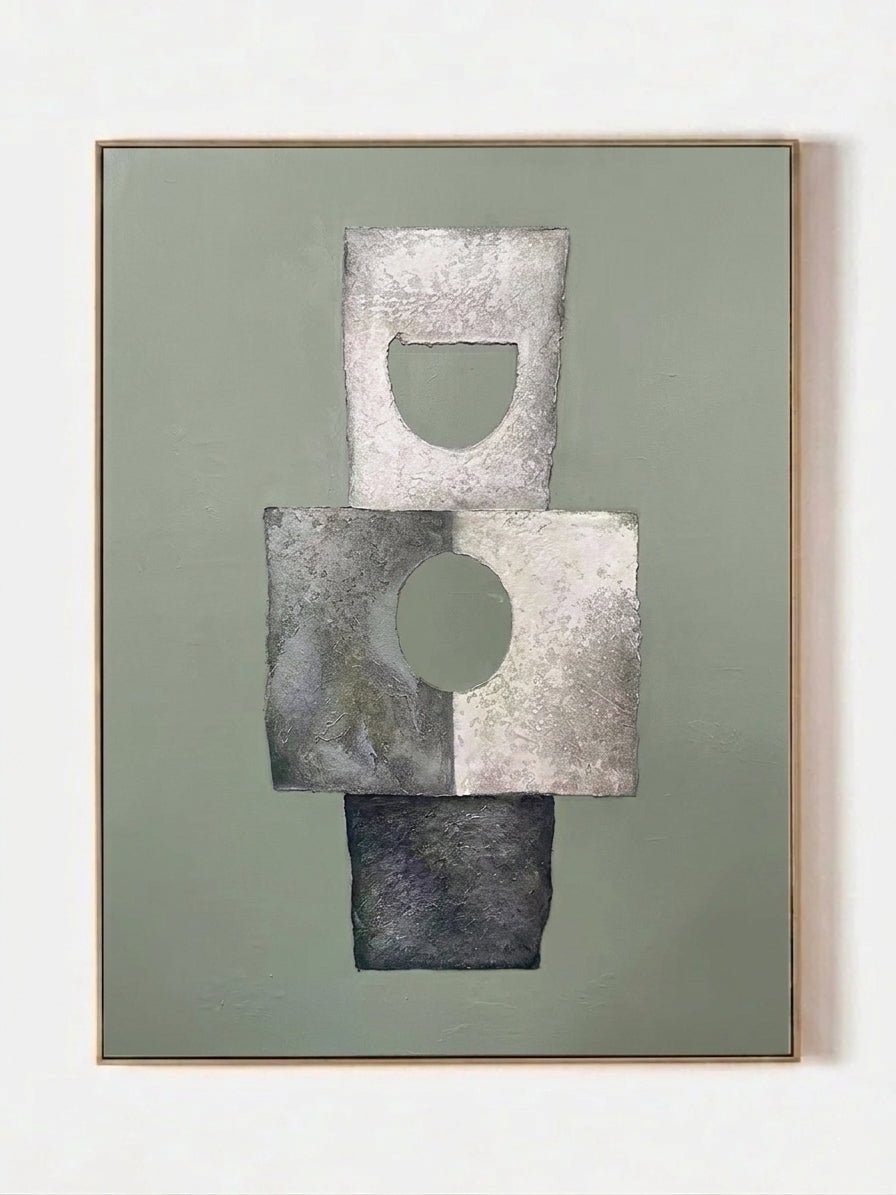 Hand-painted minimalist abstract geometric painting featuring thick stone-like texture in sage green, grey, and white in a gold frame.
