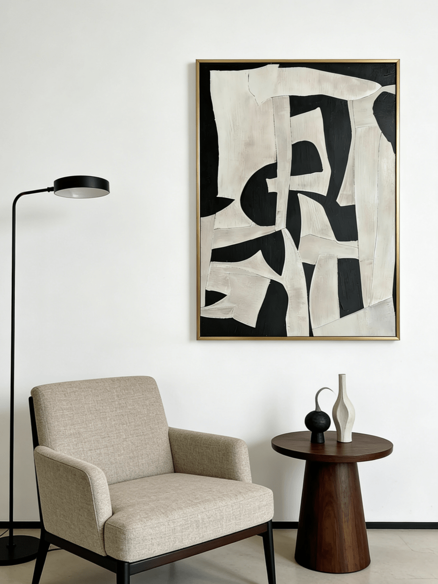 Large vertical hand-painted abstract painting with bold black and white geometric shapes and heavy impasto texture by Seraphina Rose in a modern luxury living room.