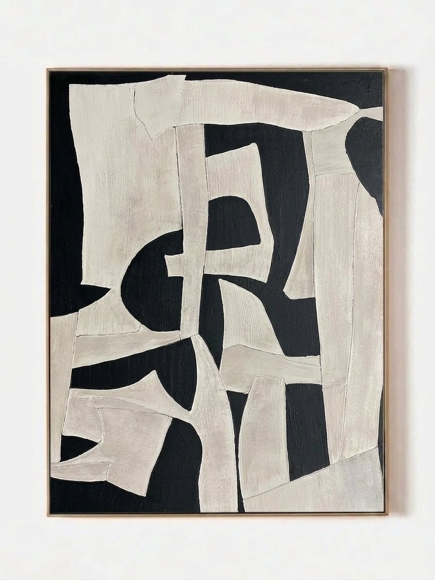 Large vertical hand-painted abstract painting with bold black and white geometric shapes and heavy impasto texture by Seraphina Rose in a modern luxury living room.