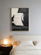 Large vertical hand-painted abstract painting with black and white textured blocks and fabric-like impasto by Seraphina Rose in a modern luxury living room.