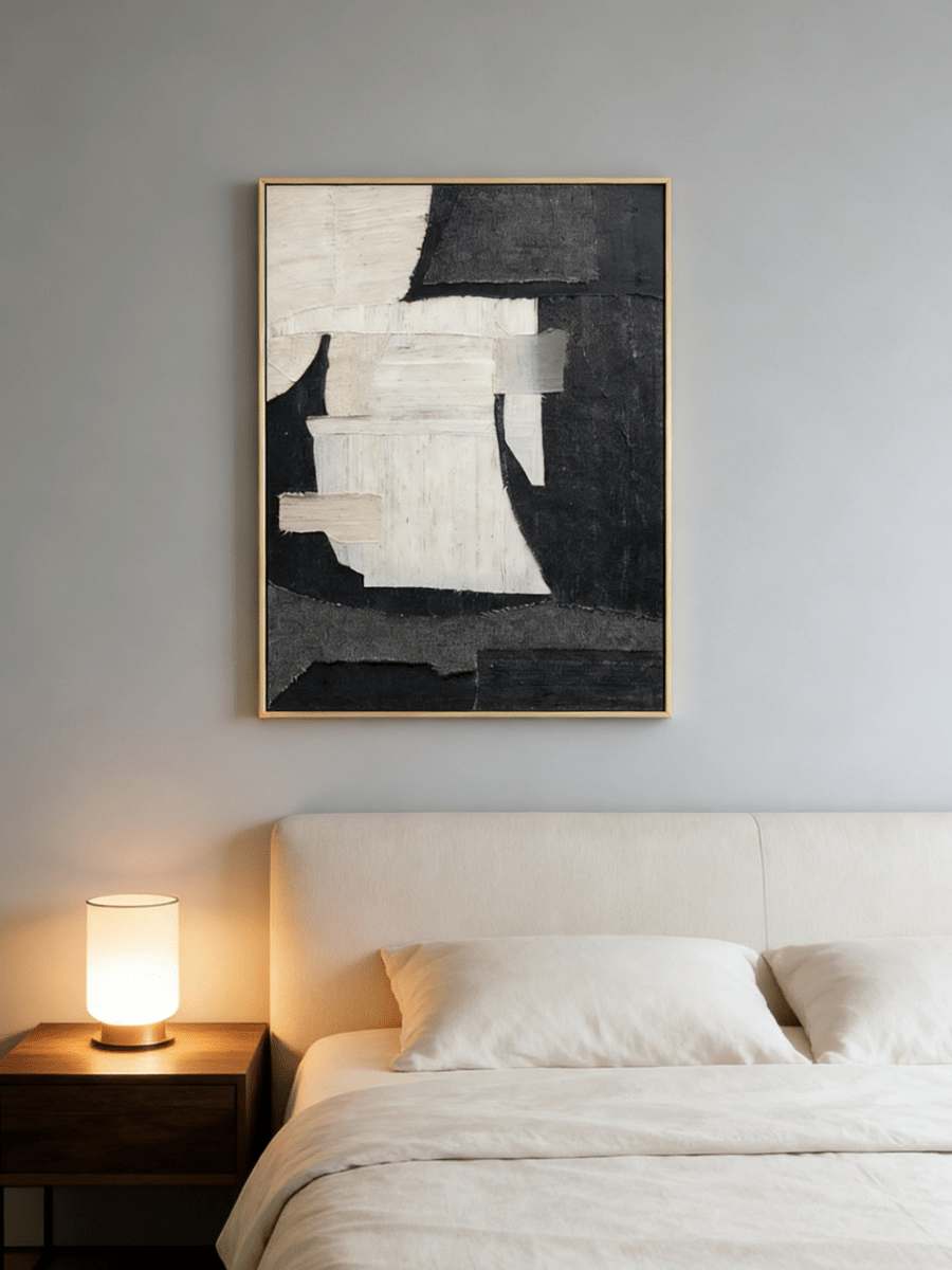 Large vertical hand-painted abstract painting with black and white textured blocks and fabric-like impasto by Seraphina Rose in a modern luxury living room.