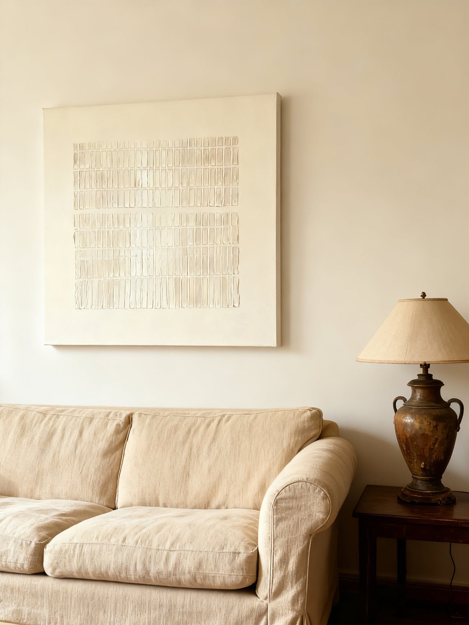 Silver textured wall art displayed in modern living room, showcasing Wabi-Sabi aesthetic in home decor