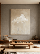 Minimalist cloud wall art displayed in a modern living room, showing how the painting enhances neutral home decor