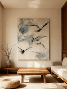 Minimalist flying geese wall art displayed in a modern living room, showing how the painting enhances neutral home decor