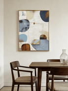 Hand-painted modern organic abstract painting featuring blue and brown geometric shapes with thick texture in a gold floater frame.