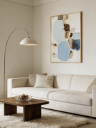 Hand-painted modern organic abstract painting featuring blue and brown stone-like shapes with heavy impasto texture in a gold frame.