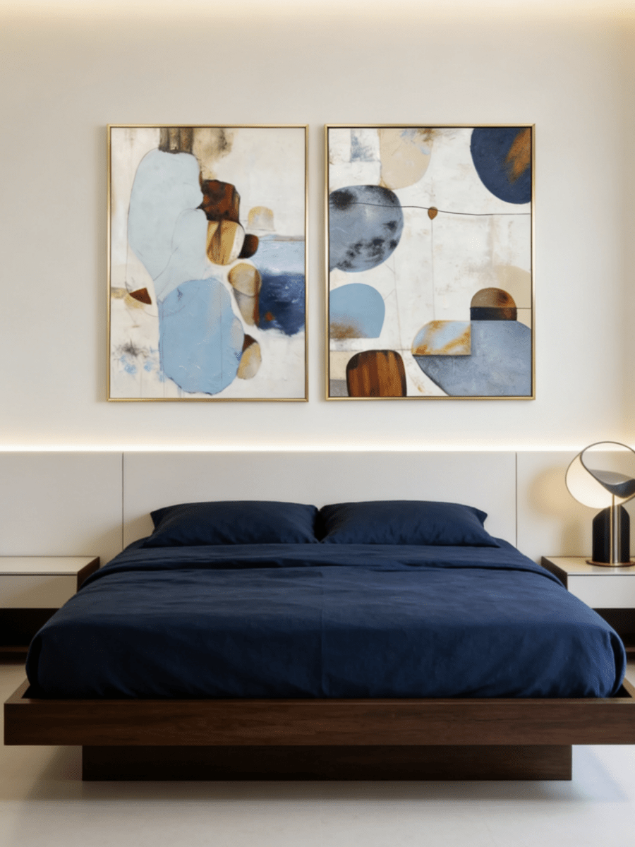 Large 2-piece hand-painted abstract diptych with organic blue and terracotta shapes and heavy texture by Seraphina Rose in a modern coastal living room.