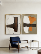 A pair of large vertical abstract paintings with a horizontal dark textured band and orange and white geometric shapes.