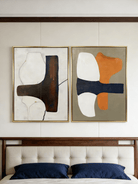 A pair of large vertical abstract paintings with a horizontal dark textured band and orange and white geometric shapes.