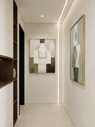 A pair of large vertical abstract paintings with geometric totem-like shapes in sage green, olive, and beige with visible heavy texture.