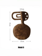 hand-carved modern primitive wood totem sculpture with dark walnut finish and hole details, large abstract wooden art for living room decor.