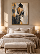 Expressive woman wall art in black, beige and ochre tones displayed in a sophisticated modern bedroom.