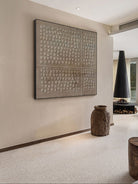 Wabi-Sabi textured circle wall art displayed in a modern living room, showcasing minimalist home decor