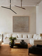 Wabi-Sabi textured circle wall art displayed in a modern living room, showcasing minimalist home decor
