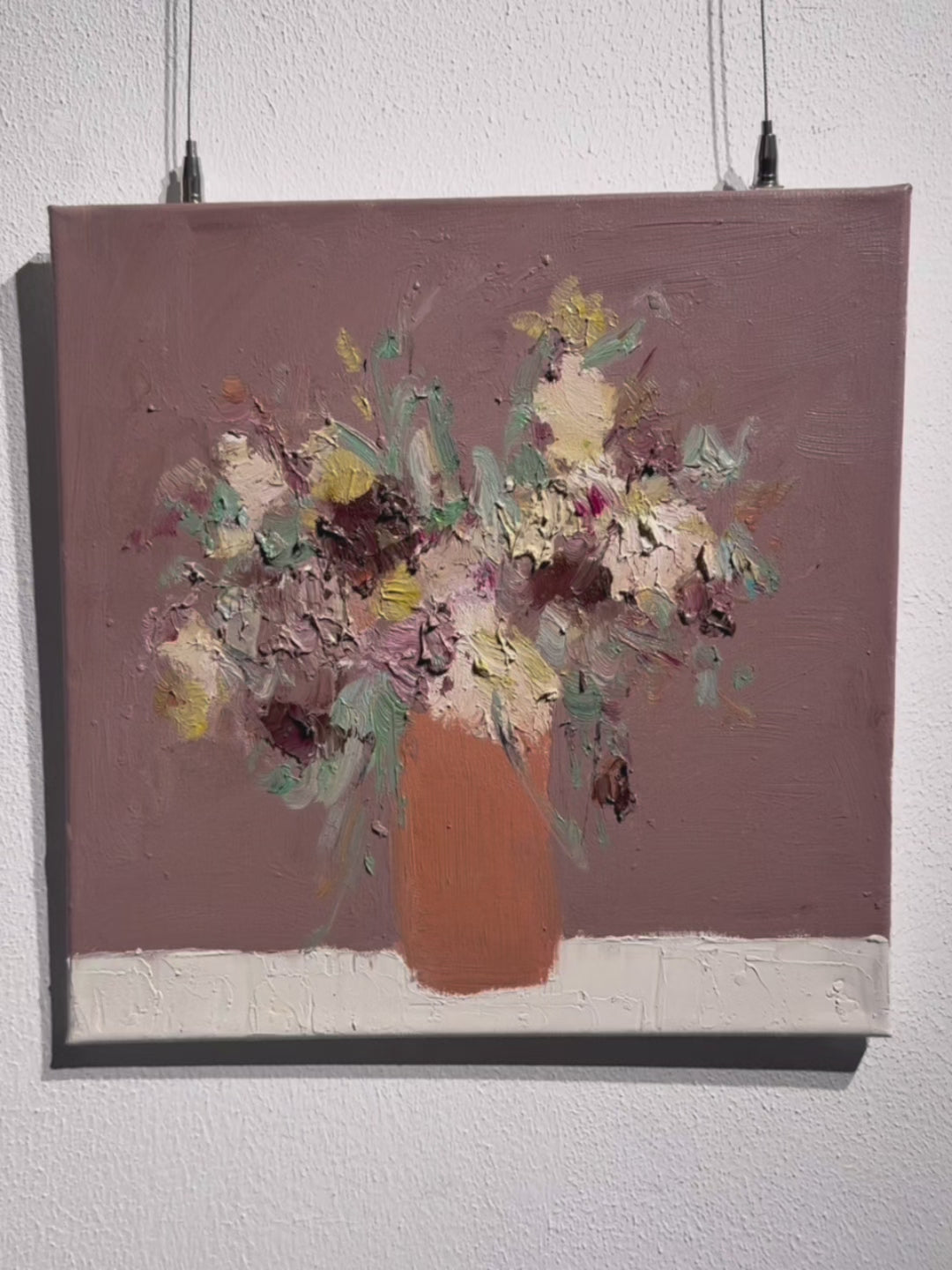 Close-up detail showing the thick impasto texture and brushstrokes in the abstract floral painting.